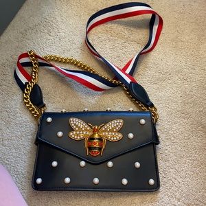 Stuffed leather bag with bee detail